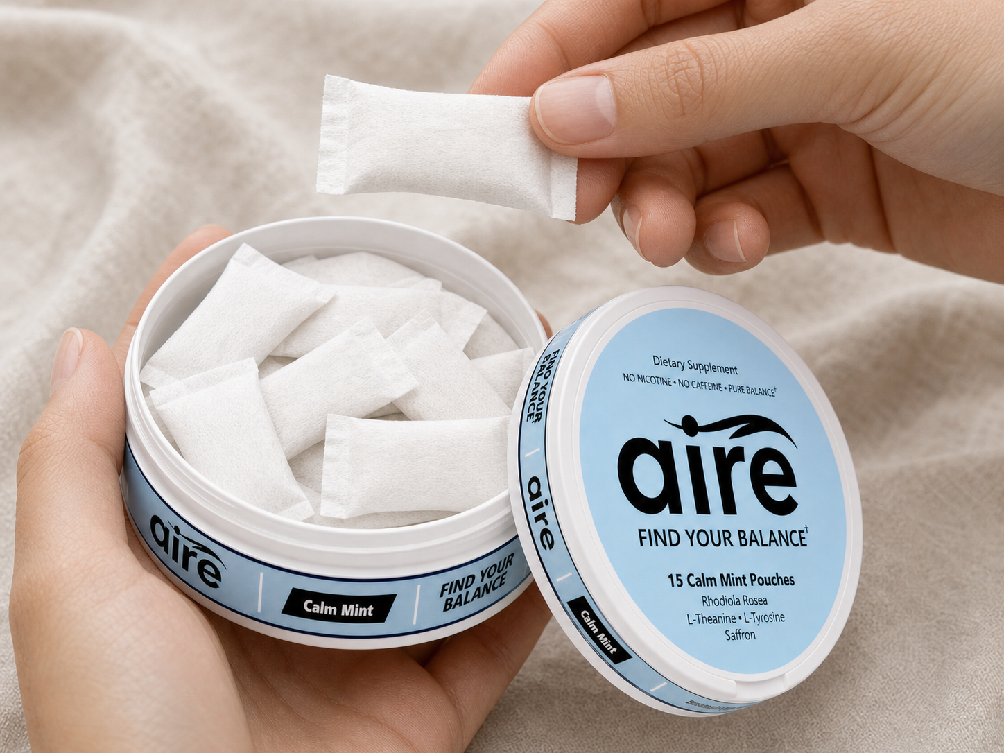 Hand lifting a pouch from an open Aire Calm Mint tin